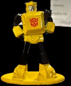 Small yellow toy robot with red emblem