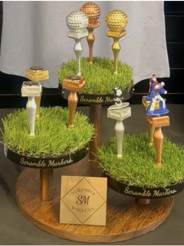 Golf-themed cake toppers on display